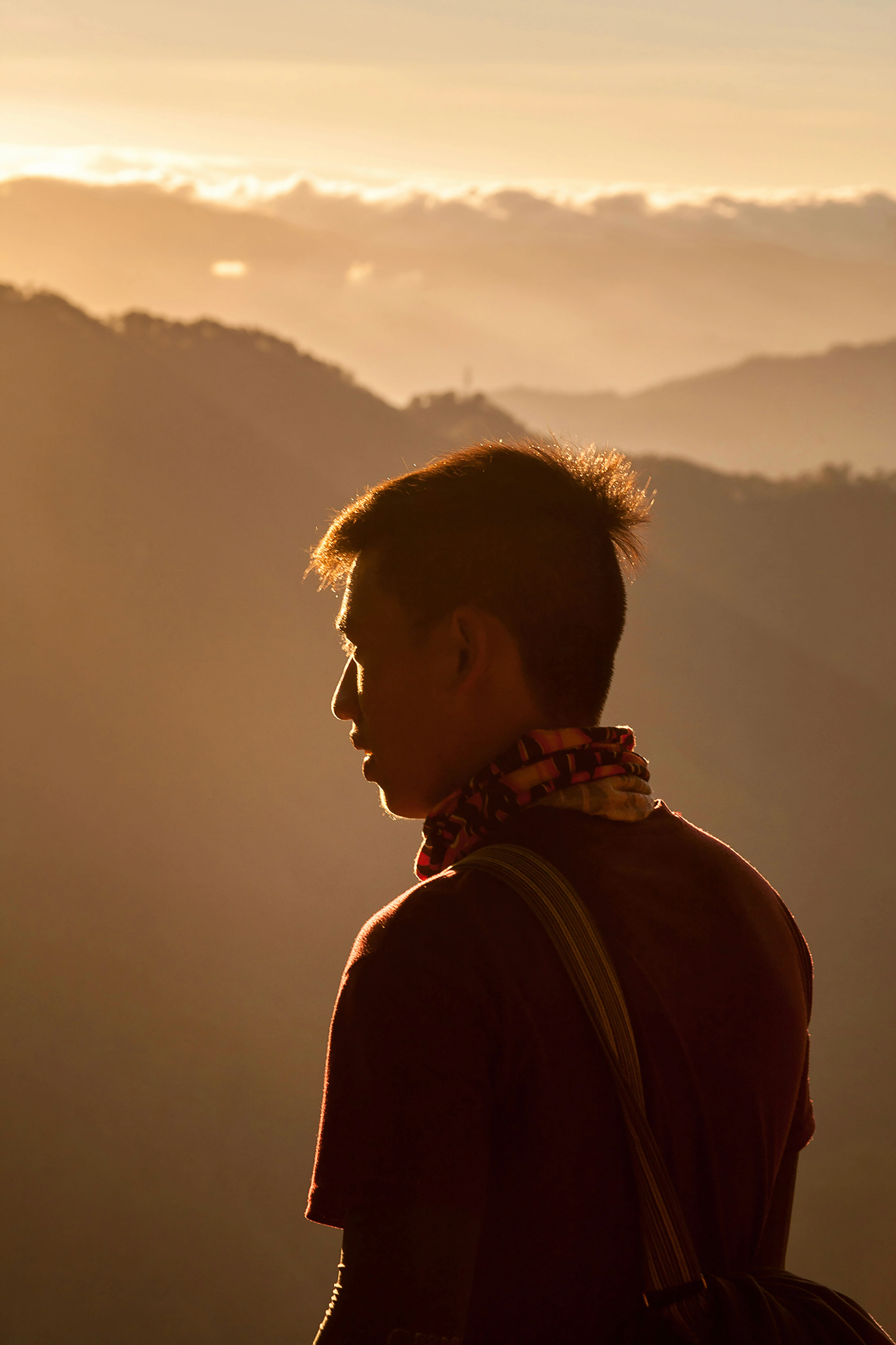 man in black jacket looking at the sky during daytime